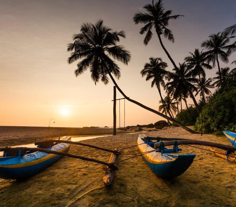 Fishing boat on the beach at sunset. Sri Lanka