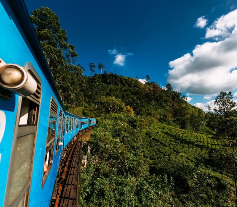 Train from Nuwara Eliya to Kandy among tea plantations in the highlands of Sri Lanka